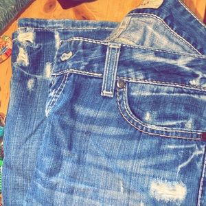 Love the rips and the design of the jeans .